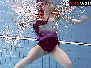 Smokin' sexy Russian redhead in the pool